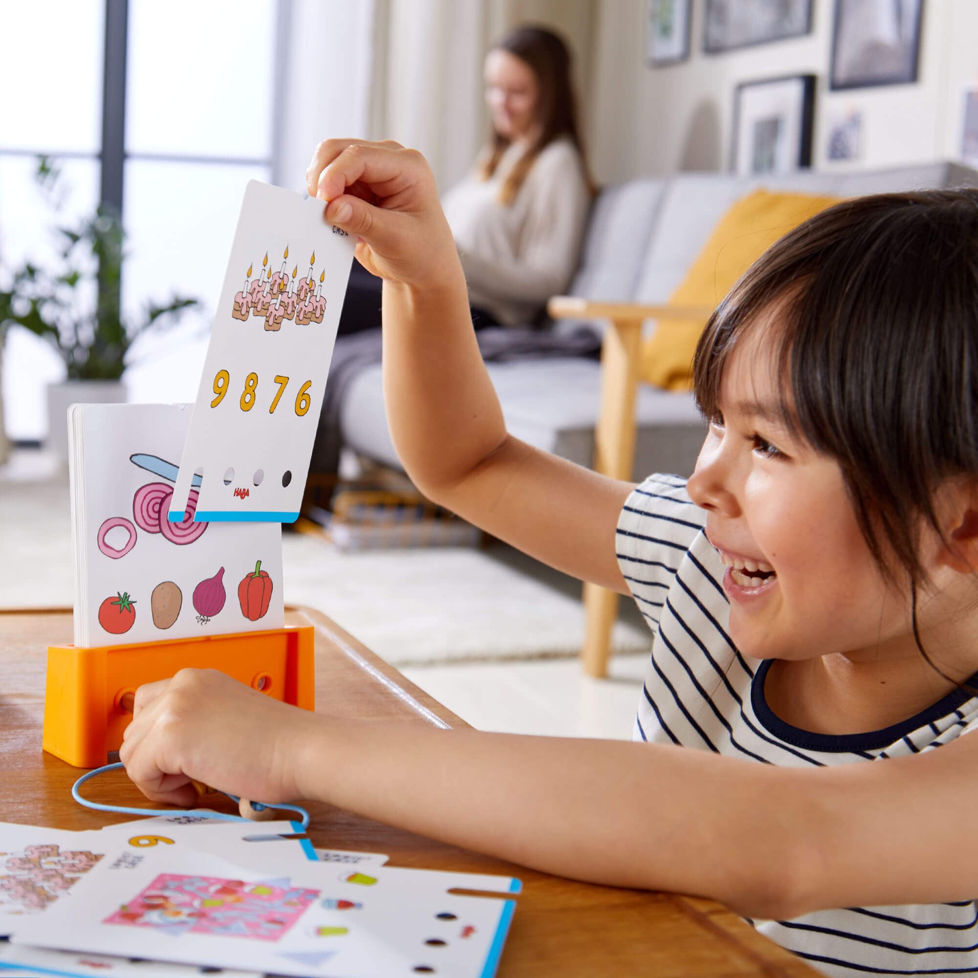 HABA Logic! CASE Starter Set 6+ – 77 Brain Teaser Puzzles for Kids, Travel Game with Self-Checking Wooden Peg