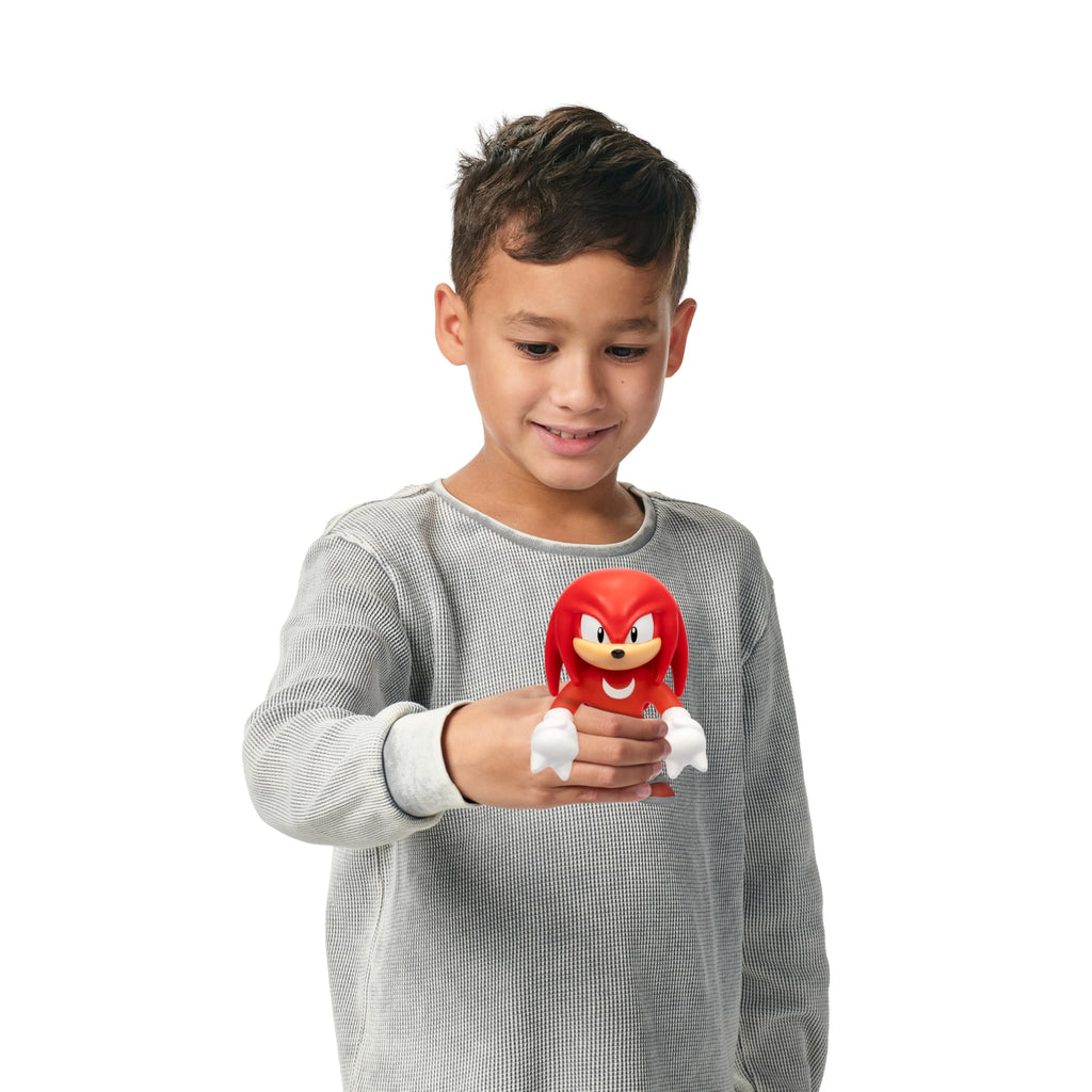 Heroes of Goo Jit Zu Unstoppable Surge Knuckles – Glow-in-the-Dark Stretchy Action Figure with Bead Filling