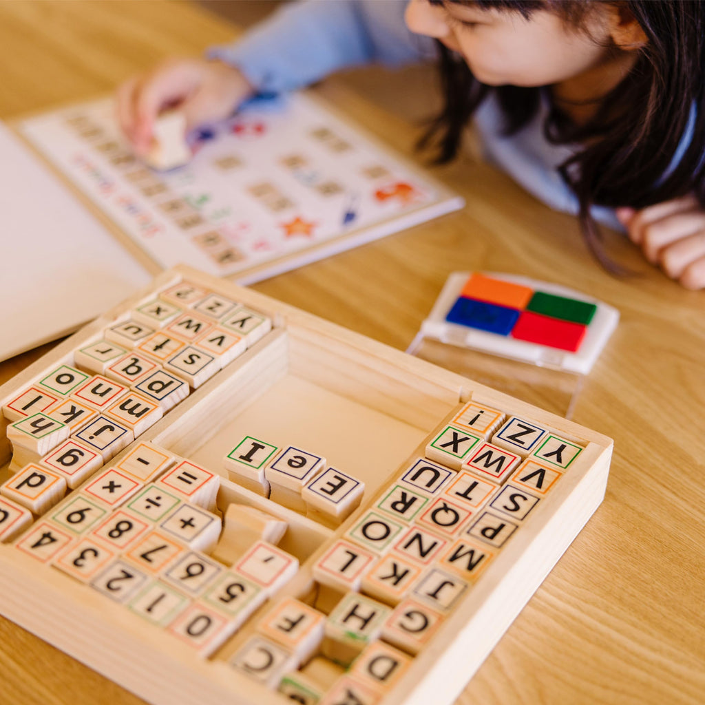 Melissa & Doug Deluxe Letters and Numbers Wooden Stamp Set – 71 Stamps, 4-Color Ink Pad, Activity Book (Ages 4-8)