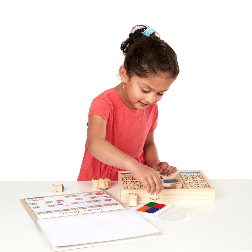 Melissa & Doug Deluxe Letters and Numbers Wooden Stamp Set – 71 Stamps, 4-Color Ink Pad, Activity Book (Ages 4-8)